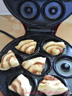 some food is being cooked in a waffle iron