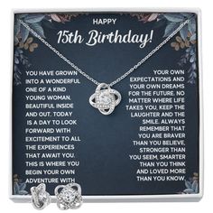 a birthday card with two necklaces and an open heart pendant on it's back