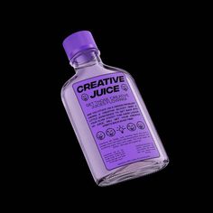 a bottle of creative juice on a black background