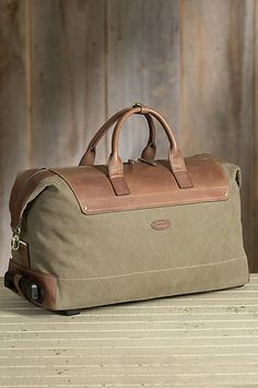 Bag on Wheels: Crafted in rugged cotton canvas that’s built to withstand the rigors, this beautiful bag on wheels  captures the spirit of first class care. Free shipping + returns. Leather And Fabric Bags, Vintage Leather Travel Bag, Travel Bag Men, Canvas Travel Bag, Canvas Leather Bag, Leather Travel Bag, Leather Luggage, Mens Leather Bag, Leather Projects