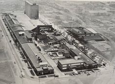 an old black and white photo of some buildings