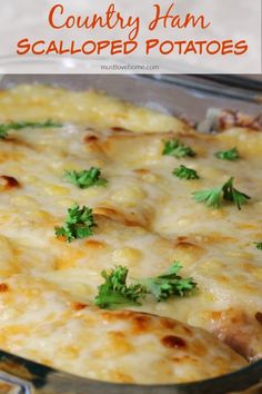 a casserole dish with cheese and parsley on top in a glass pan