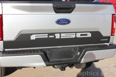 the back end of a white ford f - 150 truck