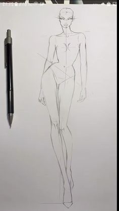 a pencil drawing of a female figure next to a pen