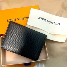 This Is A Beauty, Unisex And Giftable Epi Cardholder. This Was Stored For Many Years In New Condition. Epi Is Back In The Lv Stores, So Grab This Up For A Steal! Rectangular Card Holder With Original Box As Gift, Black Rectangular Wallets For Formal Occasions, Formal Black Rectangular Wallet, Compact Black Bag With Card Slots, Luxury Black Card Holder For Travel, Black Wallet With Card Slots, Classic Black Compact Card Holder, Classic Card Holder With Original Box As Gift, Designer Card Holder With Original Box For Everyday Use