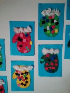 the wall is decorated with different colored paper mitts