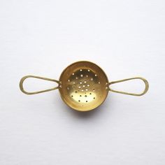 This beautiful hand-formed tea strainer by Raz Maker is made from brass and riveted with eco-silver. These tea strainers are designed to sit in your cup and catch brewed loose leaf tea from your teapot. Calming Tea, Brass Spoon, Tea Strainers, Map Store, Coffee Scoop, Silver Tea, Handmade Brass, Tea Strainer