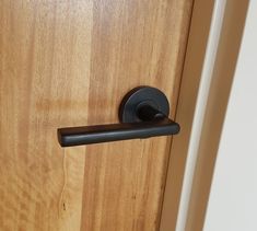 a door handle on a wooden door