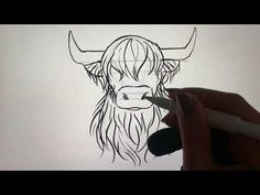 a drawing of a bull's head is shown in black and white with a marker