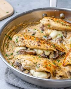 chicken with mushrooms and cheese in a pan