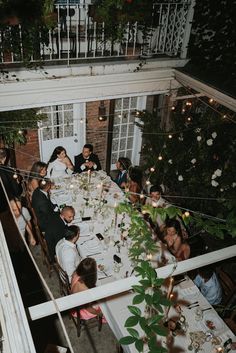 a group of people sitting around a dinner table