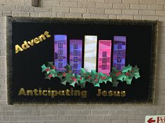 a sign on the wall that says, anticipateting jesus with christmas decorations