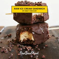 three chocolate covered ice cream sandwiches stacked on top of each other with the words raw ice cream sandwich written above them