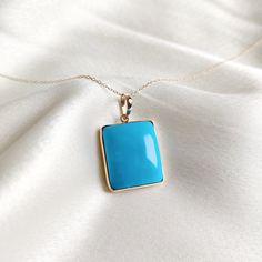 This stunning pendant is set in 14K Solid Yellow Gold with Natural Sleeping Beauty Arizona Turquoise with utmost precision. It is an unique gemstone pendant for nearly every occasion and is completely hassle-free jewelry. ITEM DETAILS * Gem: Turquoise * Gem Size: 17X20mm * Gem Shape: Rectangle Cab  * Gem Weight: 30.52 carats * Gold Purity: 14KT  * Gold Weight: 1.442 gram * Total Weight of the Pendant: 7.546 gram The Gold purity is guaranteed and it comes with authentic 14KT gold hallmark. Since my items are handmade, they are absolutely nickel and lead free. CUSTOMIZATION * Gemstone customization is available and it can be substituted with a gem of your choice. Kindly message me for the same. PACKAGING * The Pendant comes with layers of safe and secure wrapping along with Free handmade jew Turquoise 14k Gold Fine Jewelry, Fine Jewelry In 14k Gold With Turquoise, 14k Gold Turquoise Fine Jewelry, 14k Gold Turquoise Pendant Jewelry, Fine Jewelry Turquoise Pendant, Turquoise Pendant Fine Jewelry, Turquoise Gemstone Square Pendant Jewelry, Turquoise Gemstone Rectangular Pendant Jewelry, Blue Turquoise Gemstone Necklace Fine Jewelry