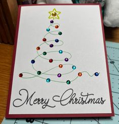 a card with a christmas tree on it