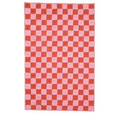 an orange and pink checkered rug on a white background