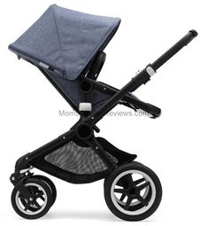 the buggy stroller is shown in black and grey with its seat folded up