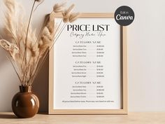 the price list is displayed next to a vase with dry grass in it on a table