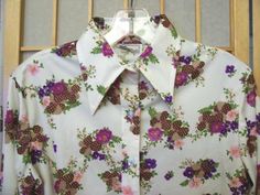 THIS IS ONE OF SEVERAL VINTAGE CLOTHING ITEMS THAT WE CURRENTLY HAVE LISTED. TO VIEW OUR OTHER  LISTINGS, JUST VISIT OUR STORE! We also offer many other vintage collectibles -  Please feel free to Check out our other items!  ITEM:   VINTAGE 1970'S WOMEN'S FLORAL PRINT SHIRT.  MADE BY BARBARA LEE.  FUN FLORAL PRINT IN DARK COLORS - PURPLE, PINK, BROWN, TAN, GREEN - AGAINST A WHITE BACKGROUND.  LONG SLEEVES WITH FRONT BUTTO Colors Purple, Floral Print Shirt, Vintage Collectibles, Sleeve Cuff, Print Shirt, Pink Brown, Dark Colors, Vintage Clothing, Vintage Collection