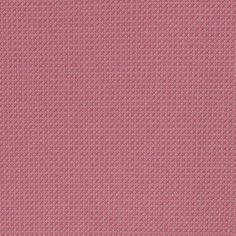 a pink and white background with small squares on it's surface, in the center is