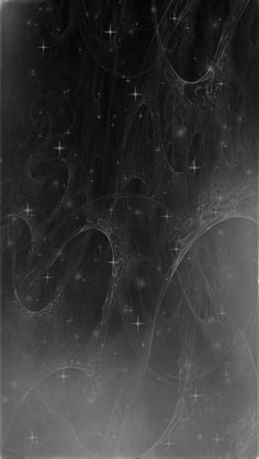 an abstract black and white photo with stars