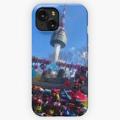 a phone case with an image of a roller coaster ride in front of the tv tower