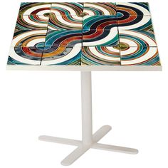 a white table with multicolored tiles on it's top and two legs