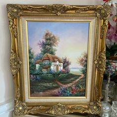 an oil painting of a cottage in the country side with flowers and trees on either side