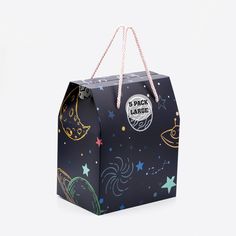 a black paper bag with stars and planets on it