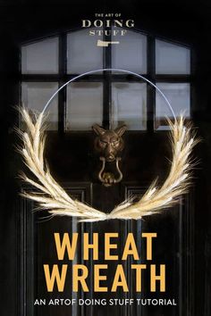 wheat wreath on the front door of a building with an image of a cat in it