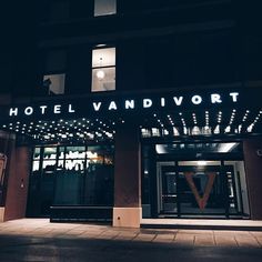 the hotel vandvort is lit up at night