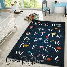 a child's room with an area rug that has letters and numbers on it