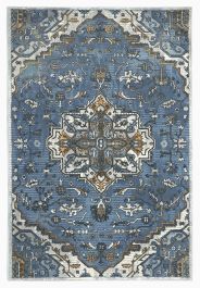 a blue rug with an ornate design on the front and back side, in various colors