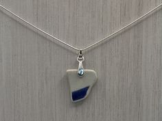 "Blue and White Scottish Sea Pottery Pendant Sterling Silver 18\" Light Snake Necklace collected from Scotland's coastline then handmade. Pottery Length :22mm WHAT IS SEA GLASS/POTTERY? 💎  Each piece of sea glass or sea pottery is absolutely unique! The sea, sand and beach pebbles help tumble them in the surf over many years.  This weathering process results in smooth and frosted appearance on glass where once they may have had sharper edges.   Each piece of glass or pottery you purchase will have it's own history, be one of a kind and they are fascinating in all their imperfections. Nature decides how it ends up!  🌊  APPEARANCE /COLOUR   🌈  Some seapottery may have minor marks or stains from spending so many years in the ocean.  Rest assured we meticulously clean every single piece. Blue Recycled Glass Pendant Necklace, Blue Sea Glass Necklaces For Jewelry Making, Blue Recycled Glass Nickel-free Necklace, Blue Nickel Free Necklace With Recycled Glass, Blue Teardrop Sea Glass Jewelry, Beach Pebbles, Sea Sand, Sea Pottery, Snake Necklace