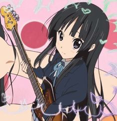 a girl with long black hair holding a guitar