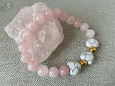 Rose Quartz is known to attract and support unconditional love. The most popular and powerful uses for a Rose Quartz crystal are for attracting love and partnership. Going beyond romantic love, the Rose Quartz crystal stone meaning is also strongly linked with compassion and unconditional love, making it a powerful stone for deepening relationships of any kind.  Rose Quartz crystal supports you on your healing journey so you can bring your heart center back to its highest frequency. Rose quartz Heart-shaped Spiritual Bracelets For Mother's Day, Spiritual Heart-shaped Bracelets For Mother's Day, Spiritual Heart Bracelets For Mother's Day, Adjustable Spiritual Bracelets For Valentine's Day, Adjustable Rose Quartz Stretch Bracelet Gift, Adjustable Natural Stone Bracelets For Valentine's Day, Rose Quartz Bracelets As Valentine's Day Gift, Rose Quartz Bracelets For Valentine's Day Gift, Heart-shaped Gemstone Beads Bracelets For Gift