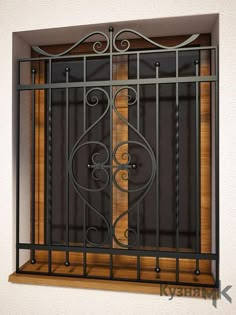 an iron and wood window frame on the wall