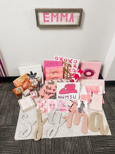 a pile of assorted items sitting on top of a carpet next to a wall