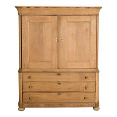 an old wooden armoire with two doors and drawers on one side, against a white background