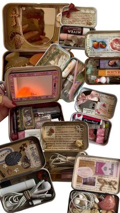 an assortment of small tins with various items in them