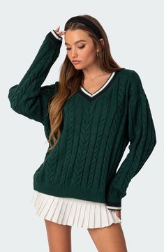 Classic cables and striped trim prep up this sweater knit from supersoft yarns in an oversized fit that layers over your tennis togs or anything else. V-neck Long sleeves with ribbed cuffs 100% Acrilan acrylic Hand wash, dry flat Imported Cable Knit Sweater Womens, Swimwear Dress, Cable Sweater, Cable Knit Sweater, Green Sweater, Sweater Knit, S Models, Set Dress, Womens Clothing Tops