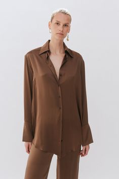 Our Chocolate Brown Silk oversized tailored shirt is made of 100% Silk. The shirt features a traditional collar, button stand with mother of pearl buttons and oversized cuffs with our signature button detail. Brown Silk Button Down Shirt Outfit, Satin Brown Shirt, Oversized Brown Collared Blouse, Elegant Brown Button-up Shirt, Button Down Shirt Women, Luxury Brown Button-up Shirt, Brown Silk, French Seam, Tailored Shirts