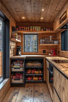 an open kitchen with wooden walls and flooring