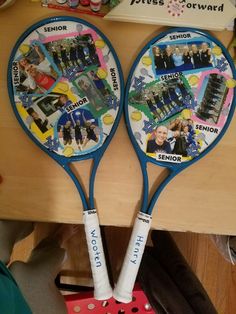 two tennis racquets decorated with pictures and words