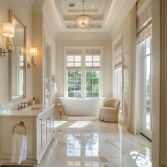 a large bathroom with marble flooring and white walls, along with an oval tub in the center