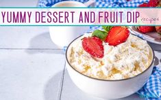 a bowl filled with whipped cream and strawberries on top of a blue checkered table cloth