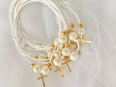 Martirika-Witness Pins-Greek Baptism-Cross Martirika-Bracelet Martirika for girls-First Communion gifts Beautiful martirika made into a bracelet look. White cord with gold cross and beads. A ribbon can be attached with your color theme for a bit extra charge. Please contact me before you order. This listing is for 50 martyrika. Martirika will come in a decorated box/basket or tray. If you like another quantity please contact me so I can add an option for you. Adjustable Gold Rosary Bracelet For Baptism, Gold Cross Bracelet For Baptism, White Adjustable Bracelet For Confirmation, Adjustable White Bracelet For Confirmation, White Rosary Bracelet For First Communion, White Cross Rosary Bracelet For First Communion, Handmade Gold Bracelet For First Communion, Handmade Gold Bracelets For First Communion, Adjustable White Rosary Bracelet For Confirmation