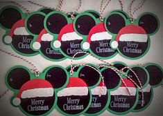 mickey mouse christmas tags with santa hats on them