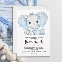 an elephant baby shower is next to a teddy bear