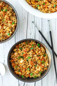 garlic salmon fried rice in a skillet with chopsticks on the side and an orange text overlay that reads garlic salmon fried rice